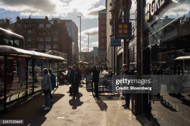 Shoppers wait at bus stops in central Belfast, Northern Ireland, on Saturday, Feb. 25, 2023. The UK government has never been happy with Northern...