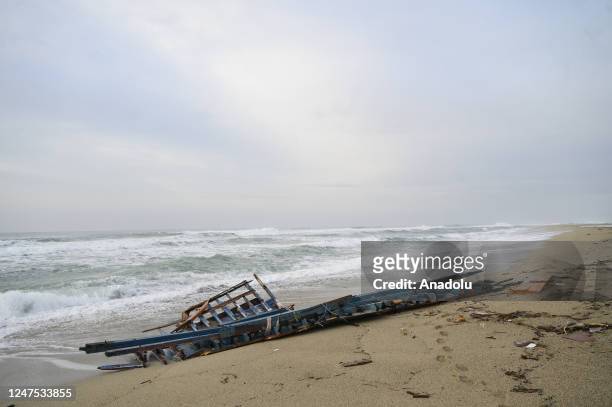 View of the wreckage of the ship carrying the immigrants on the beach as search and rescue operations continue to find about 20 migrants in Crotone,...