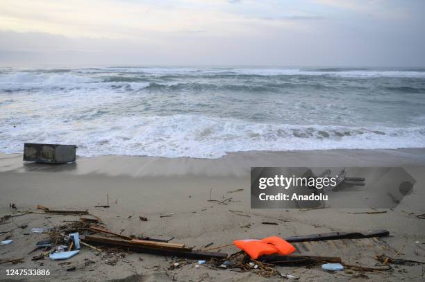 View of the wreckage of the ship carrying the immigrants on the beach as search and rescue operations continue to find about 20 migrants in Crotone,...