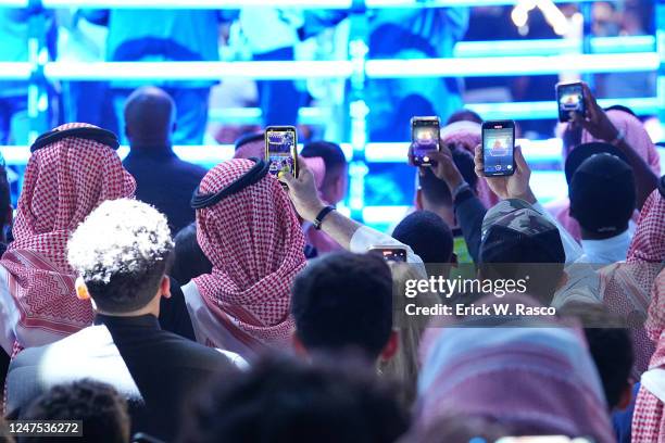 Fans take cell phone photos during the Tommy Fury vs Jake Paul fight at Diriyah Arena. Diriyah, Saudi Arabia, 2/25/2023 CREDIT: Erick W. Rasco