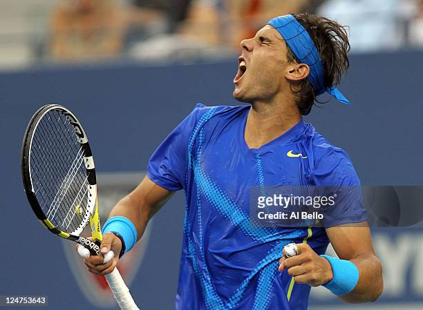 Rafael Nadal of Spain reacts against Novak Djokovic of Serbia during the Men's Final on Day Fifteen of the 2011 US Open at the USTA Billie Jean King...