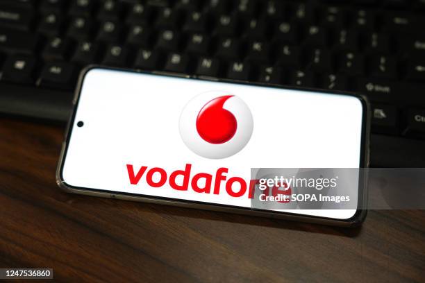 In this photo illustration, a Vodafone Group logo seen displayed on a smartphone screen.