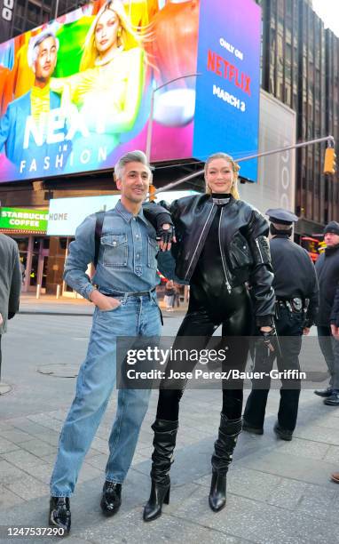 Tan France and Gigi Hadid are seen in front of their Netflix's 'Next in Fashion' show poster on February 27, 2023 in New York City.