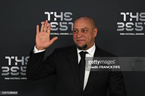 Brazilian former football player Roberto Carlos poses upon arrival to attend the Best FIFA Football Awards 2022 ceremony in Paris on February 27,...