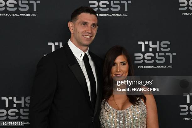 Argentina and Aston Villa goalkeeper Emiliano Martinez and his wife Amanda pose upon arrival to attend the Best FIFA Football Awards 2022 ceremony in...