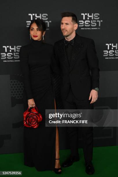 Argentina and Paris Saint-Germain forward Lionel Messi and his wife Antonela Roccuzzo pose upon arrival to attend the Best FIFA Football Awards 2022...