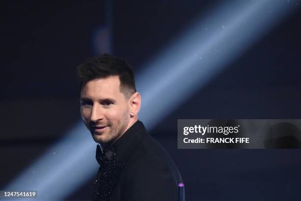 Argentina and Paris Saint-Germain forward Lionel Messi poses on stage after receiving the Best FIFA Mens Player award during the Best FIFA Football...