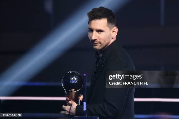 Argentina and Paris Saint-Germain forward Lionel Messi poses on stage after receiving the Best FIFA Mens Player award during the Best FIFA Football...