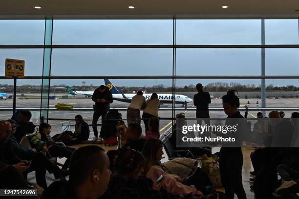 Passengers waiting to board a Ryanair plane at Dublin International Airport, in Dublin, Ireland, on February 17, 2023. Almost every week, Ryanair,...