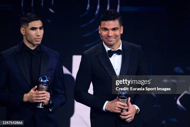 Achraf Hakimi of Paris Saint-Germain and Carlos Casemiro of Manchester United posing for photos with his trophy of FIFA Men's World 11 during The...