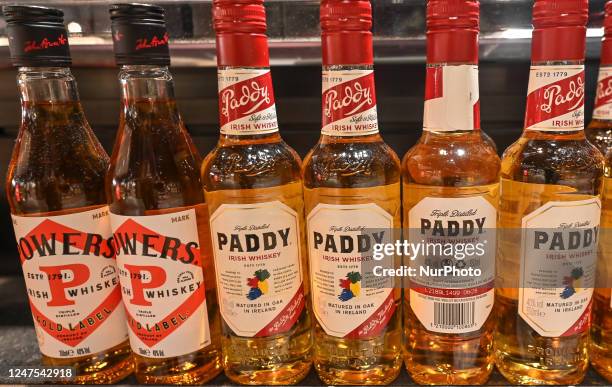Selection of Powers and Paddy Irish whiskey on display in a Duty Free shop at Dublin Airport, in Dublin, Ireland, on February 17, 2023. According to...