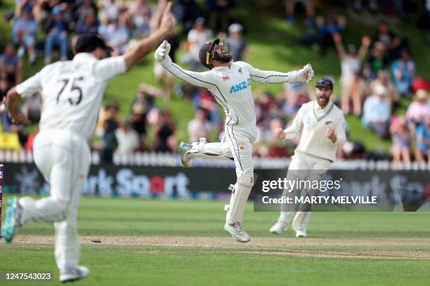 New Zealand's wicketkeeper Tom Blundell celebrates running out England's Harry Brook on day five of the second cricket test match between New Zealand...