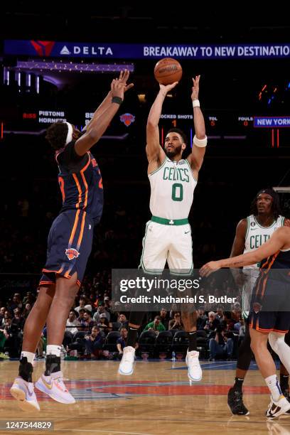 Jayson Tatum of the Boston Celtics shoots a three point basket during the game against the New York Knicks on February 27, 2023 at Madison Square...