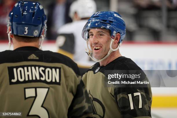 Jack Johnson and Brad Hunt of the Colorado Avalanche warm up prior to the game against the Vegas Golden Knights on Military Appreciation Night at...