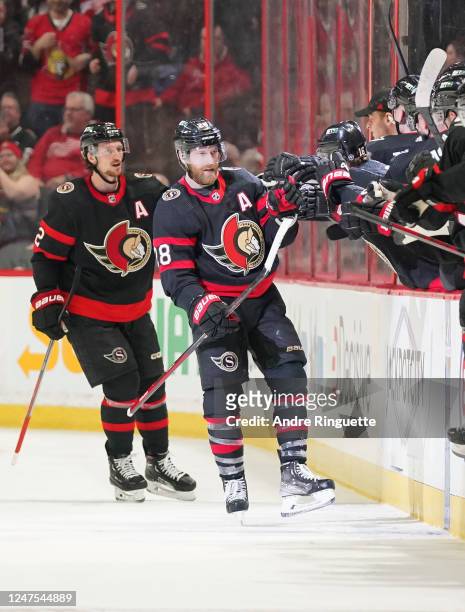 Claude Giroux of the Ottawa Senators celebrates his second period goal against the Detroit Red Wings with teammates at the players bench at Canadian...