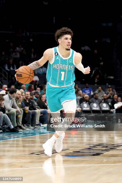 LaMelo Ball of the Charlotte Hornets dribbles the ball against the Detroit Pistons on February 27, 2023 at Spectrum Center in Charlotte, North...