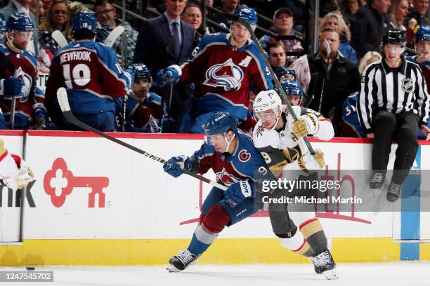 Evan Rodrigues of the Colorado Avalanche skates against Reilly Smith of the Vegas Golden Knights at Ball Arena on February 27, 2023 in Denver,...