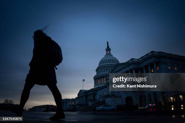 Pedestrian walks through the Capitol Plaza with the dome of the U.S. Capitol Building as a backdrop on Monday, Feb. 27, 2023 in Washington, DC.