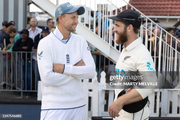 New Zealand's Kane Williamson speaks with England's Joe Root after the second cricket Test match between New Zealand and England at the Basin Reserve...