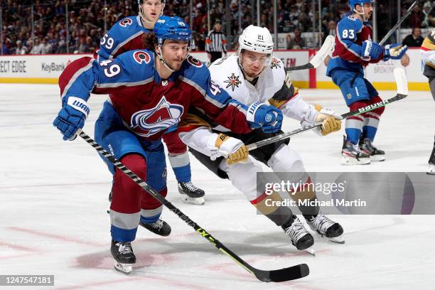 Samuel Girard of the Colorado Avalanche skates against Brett Howden of the Vegas Golden Knights at Ball Arena on February 27, 2023 in Denver,...