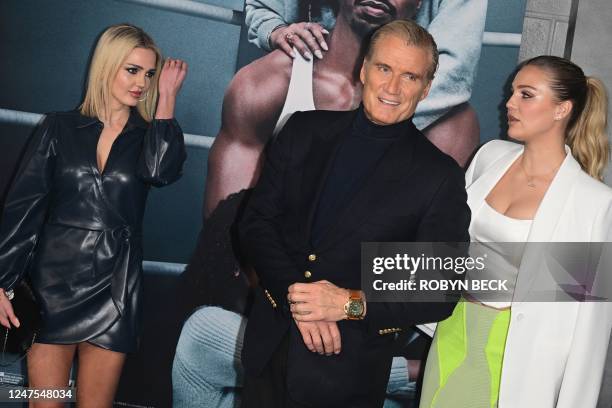 Sweedish actor Dolph Lundgren with his daughters Greta and Ida Lindgren arrive for the Los Angeles premiere of Creed III at the TCL Chinese Theater...