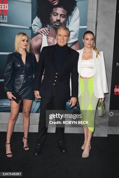 Sweedish actor Dolph Lundgren with his daughters Greta and Ida Lindgren arrive for the Los Angeles premiere of Creed III at the TCL Chinese Theater...