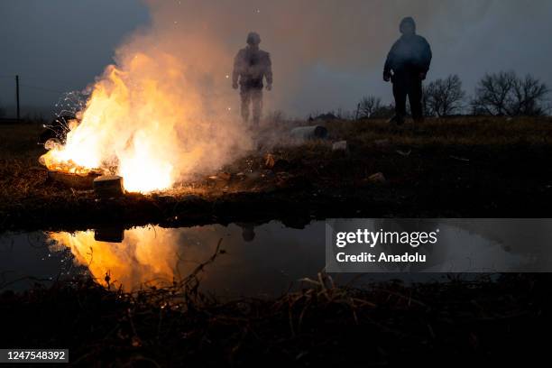 Officers of the Donetsk oblast DSNS demining team work to clear mines and unexploded ordnance from the area outside of Lyman, Ukraine on Feb 27, 2023.