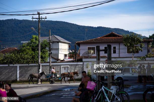 Man transports wares with a cart trained by a horse in Paraty, Rio De Janeiro on February 23, 2023.