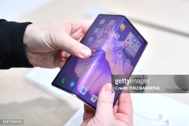 Picture taken on February 28, 2023 shows the Huawei Mate Xs 2 foldable smartphone at the Mobile World Congress , the telecom industry's biggest...