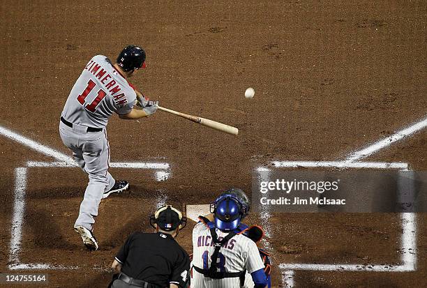 Ryan Zimmerman of the Washington Nationals connects on a first inning base hit against the New York Mets at Citi Field on September 12, 2011 in the...