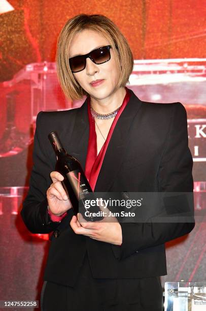 Yoshiki holds a "Y by YOSHIKI" signature Napa wine during a press conference for the "Evening/Breakfast with YOSHIKI 2023" Dinner Show announcement...