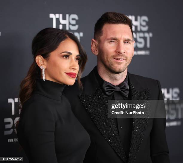 Antonela Roccuzzo and Lionel Messi pose for a photo on the Green Carpet ahead of The Best FIFA Football Awards 2022 on February 27, 2023 in Paris,...