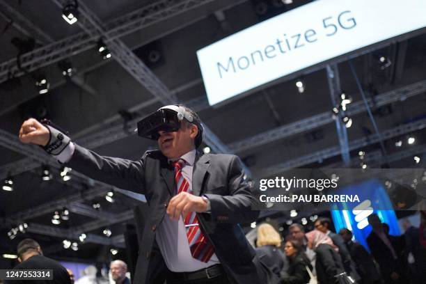 Visitor wears augmented reality glasses powered by 5G of Japanese e-sport technology company Hado at the Mobile World Congress , the telecom...