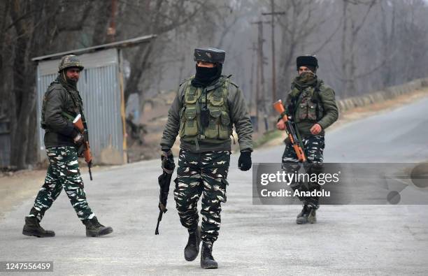 Indian soldiers patrol near the gunfight site in Padgampora Village of South Kashmir, India on February 28, 2023. Two local militants and an Indian...