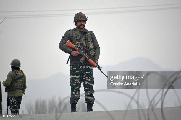 Indian soldiers patrol near the gunfight site in Padgampora Village of South Kashmir, India on February 28, 2023. Two local militants and an Indian...