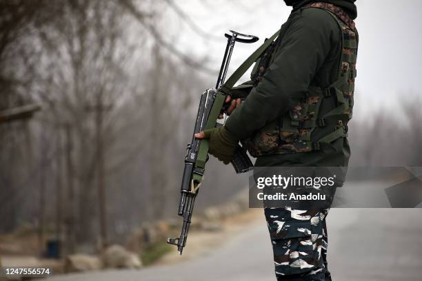 Indian soldiers patrol near the gunfight site in Padgampora Village of South Kashmir, India on February 28, 2023. Two local militants and an Indian...