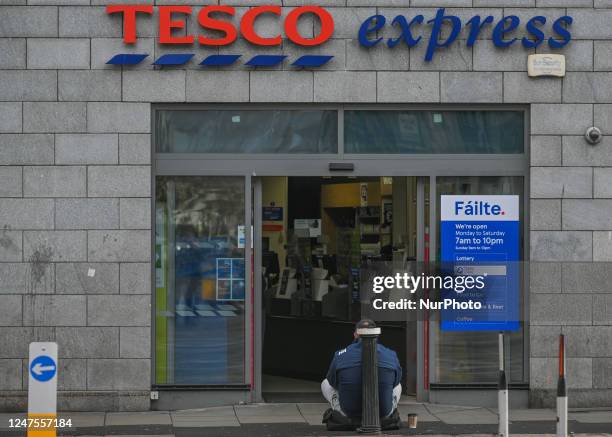 Begger seen outside a Tesco shop in Dublin, Ireland, on February 17, 2023.