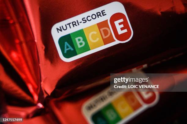 Picture taken on February 28, 2023 shows nutri-score scales on the packaging of products sold at a supermarket in Nantes, western France.