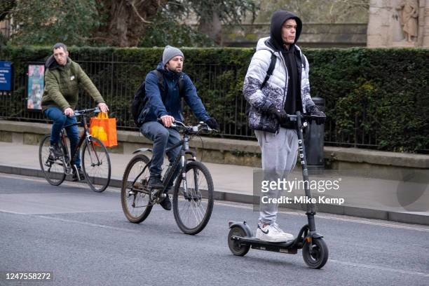 Cyclists and an eScooter rider on 21st February 2023 in Oxford, United Kingdom. Cycling is a very popular mode of transport in Oxford which is known...