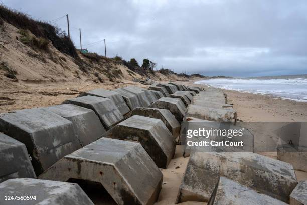 Concrete sea defences are placed on the beach in an attempt to protect a properties after erosion swept away large parts of the sand, on February 28,...