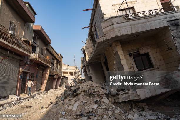 Child walks near destroyed buildings in the city of Jindires on February 28, 2023 near Aleppo, Syria. A 7.8-magnitude earthquake hit near Gaziantep,...