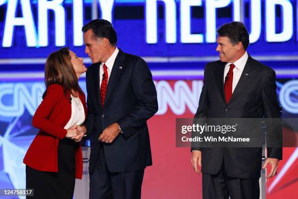 Republican presidential candidates Rep. Michele Bachmann, Mitt Romney and Gov. Rick Perry as they are introduced for a debate sponsored by CNN and...