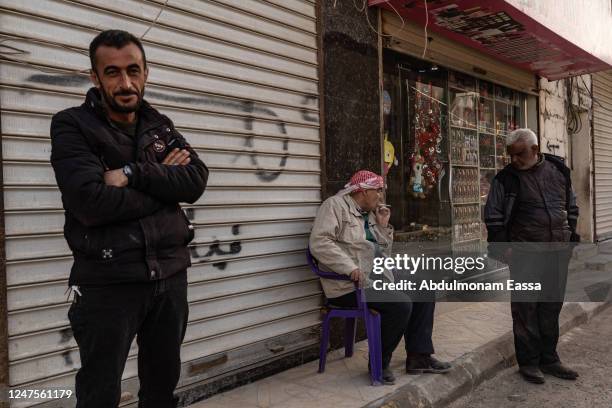 Residents talk in the city of Jindires on February 28, 2023 near Aleppo, Syria. A 7.8-magnitude earthquake hit near Gaziantep, Turkey in the early...
