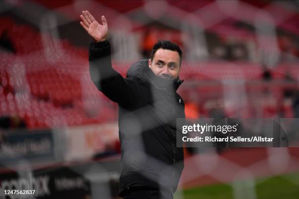 Roberto De Zerbi, Brighton and Hove Albion manager through the net before the Emirates FA Cup Fifth Round match between Stoke City and Brighton &...