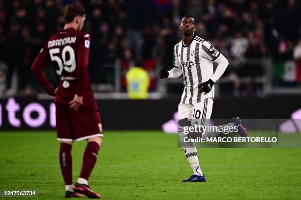 Juventus' French midfielder Paul Pogba runs in the pitch during the Italian Serie A football match between Juventus and Torino at the Juventus...