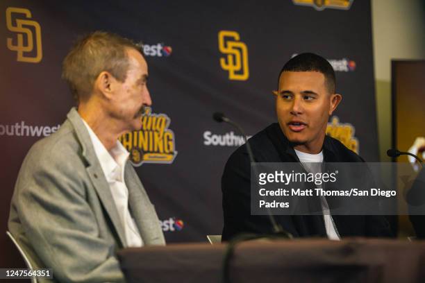Manny Machado of the San Diego Padres speaks to Padres Chairman Peter Seidler at his contract extension press conference at the Peoria Sports Complex...