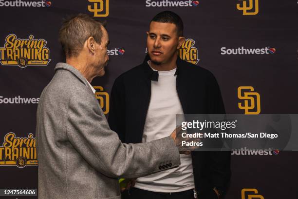Manny Machado of the San Diego Padres speaks with Padres Chairman Peter Seidler after his contract extension press conference at the Peoria Sports...