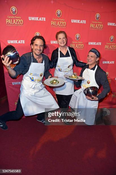 Oliver Mommsen, Cornelia Poletto and Ralf Bauer during the charity night at Cornelia Poletto's Palazzo on February 28, 2023 in Hamburg, Germany.