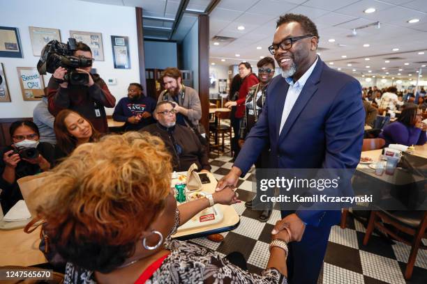 Mayoral candidate and Cook County Commissioner Brandon Johnson chats with a supporter inside Manny's Cafeteria and Delicatessen on City's Mayoral...