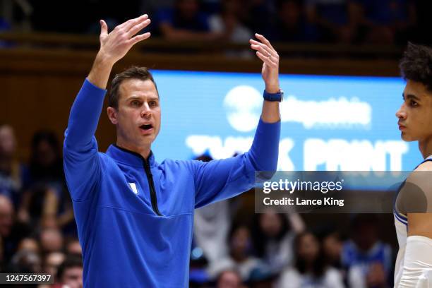 Head coach Jon Scheyer of the Duke Blue Devils calls for his team during the first half of their game against the NC State Wolfpack at Cameron Indoor...